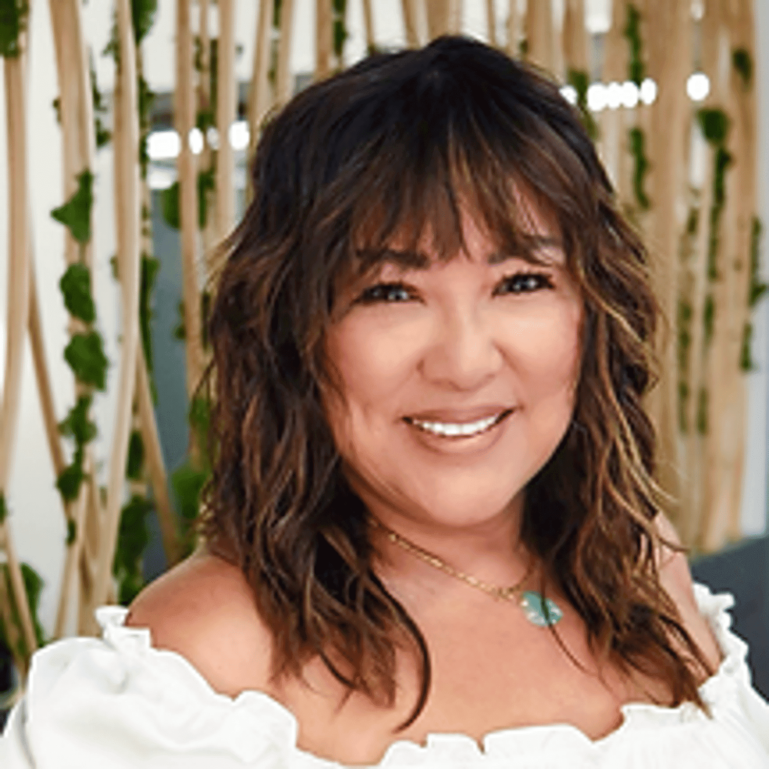 Portrait of Cathy, a professional stylist at Tangles Salon, showcasing their expertise and style.