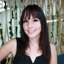 Portrait of Bri, a professional stylist at Tangles Salon, showcasing their expertise and style.