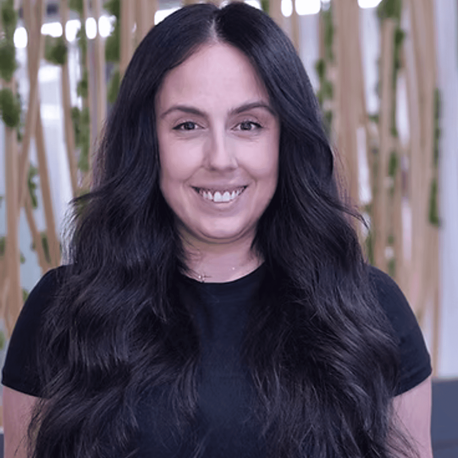 Portrait of Lilit, a professional stylist at Tangles Salon, showcasing their expertise and style.