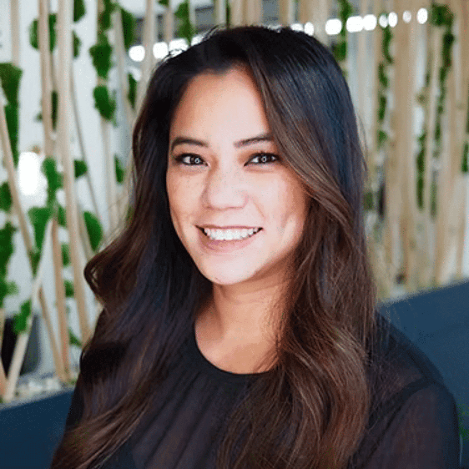 Portrait of Nicole, a professional stylist at Tangles Salon, showcasing their expertise and style.