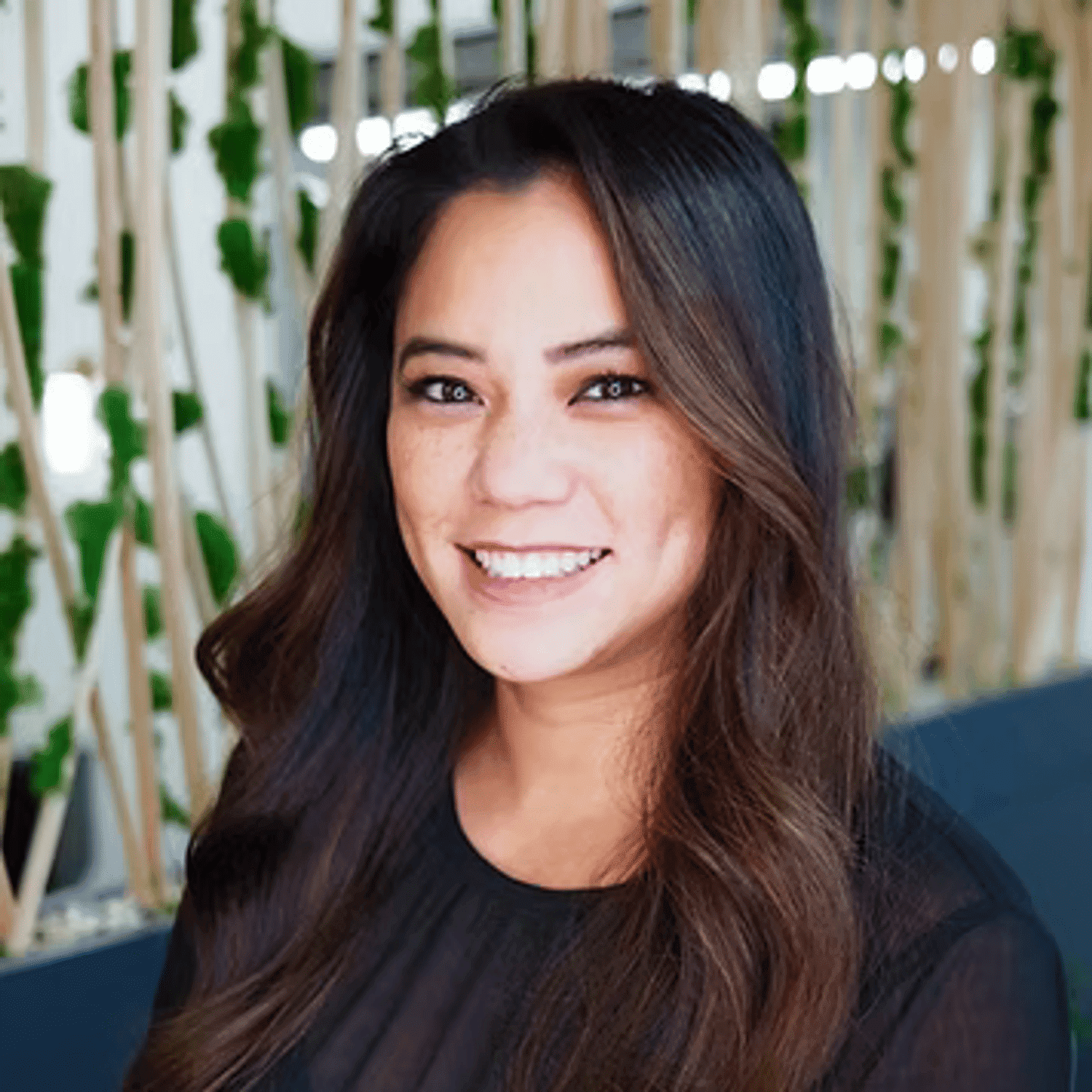 Portrait of Nicole, a professional stylist at Tangles Salon, showcasing their expertise and style.