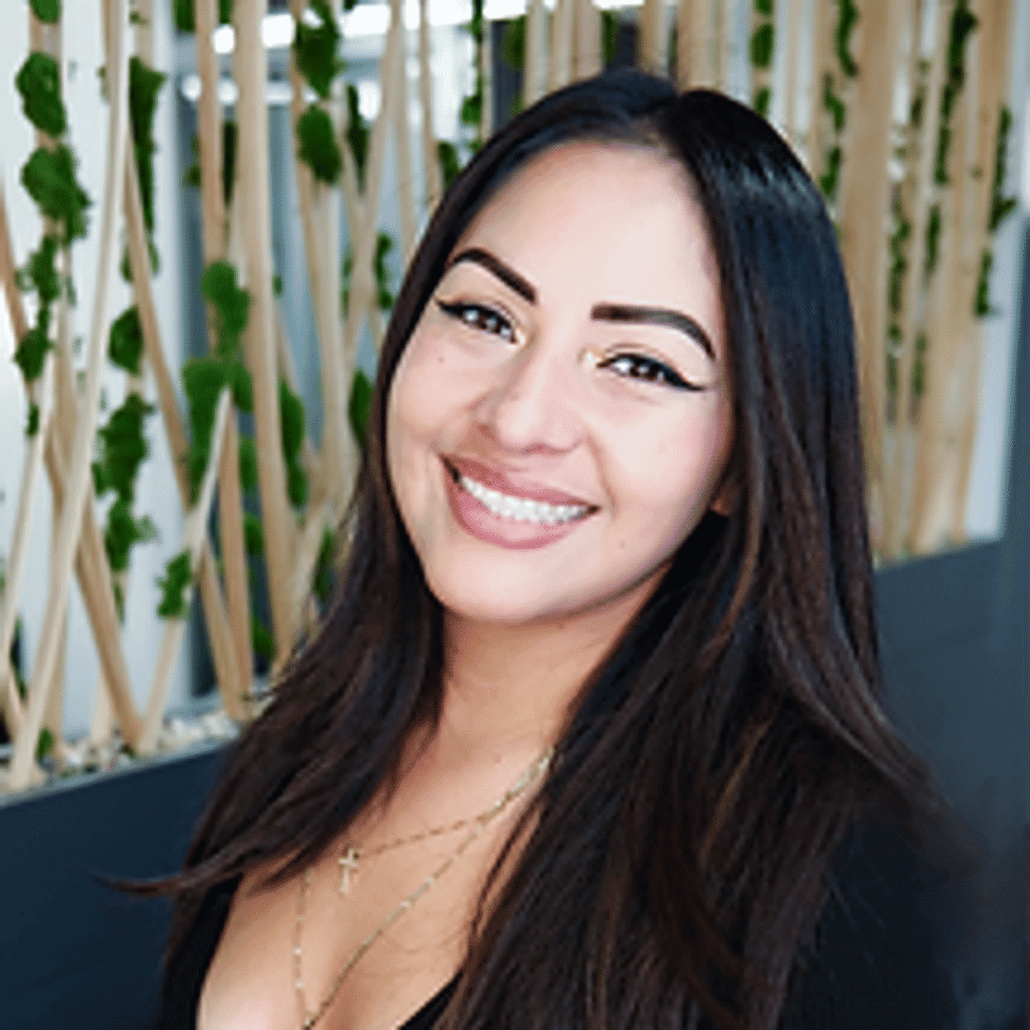 Portrait of Laura, a professional stylist at Tangles Salon, showcasing their expertise and style.