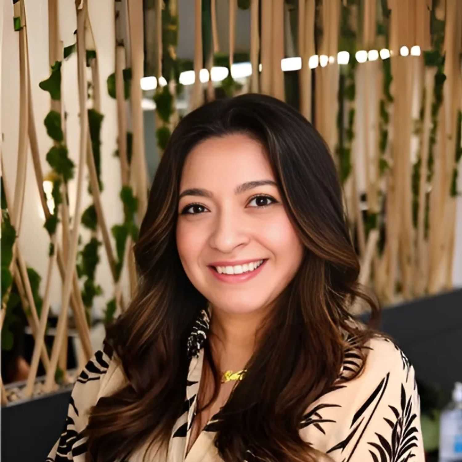 Portrait of Annelise, a professional stylist at Tangles Salon, showcasing their expertise and style.