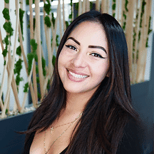 Portrait of Laura, a professional stylist at Tangles Salon, showcasing their expertise and style.