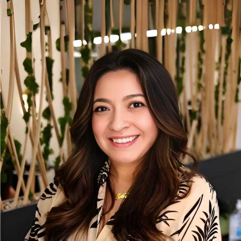 Portrait of Annelise, a professional stylist at Tangles Salon, showcasing their expertise and style.